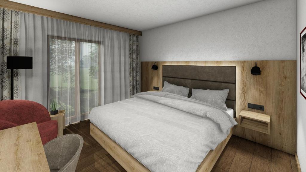 Postel nebo postele na pokoji v ubytování Dorf Hotel Grüner Baum