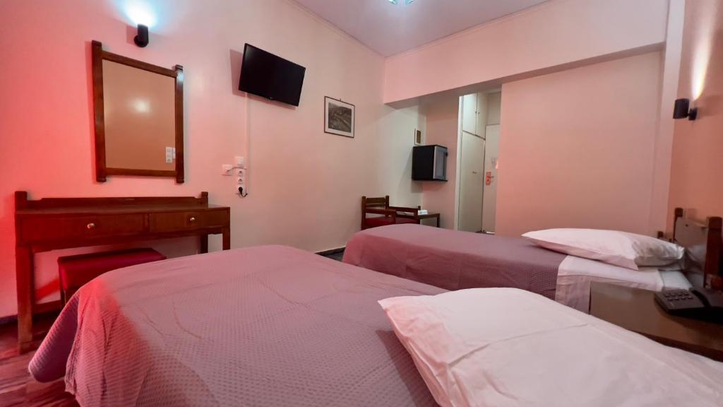Postel nebo postele na pokoji v ubytování Hotel Cosmos