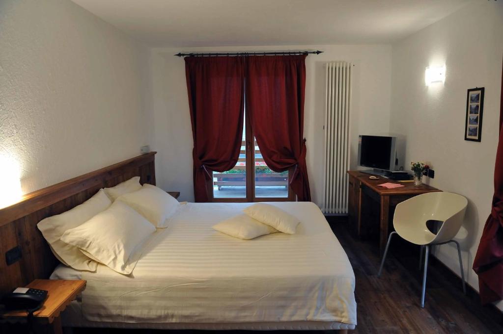 Postel nebo postele na pokoji v ubytování Ellex Eco Hotel