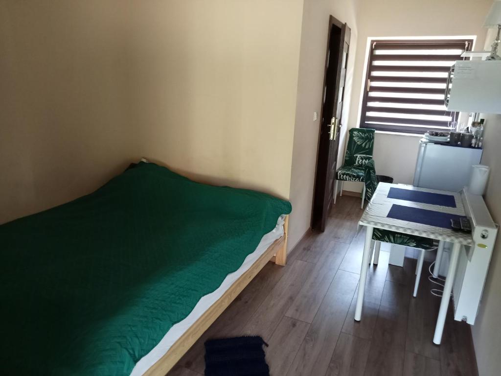 Postel nebo postele na pokoji v ubytování Zajazd Gawrysiówka