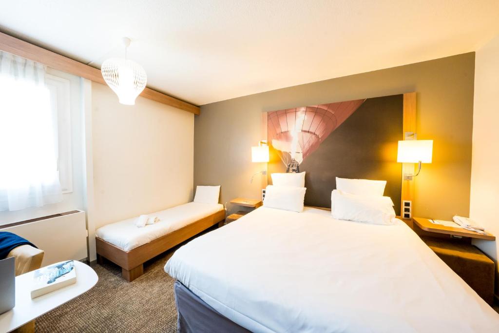 Postel nebo postele na pokoji v ubytování Mercure Vienne Sud Chanas