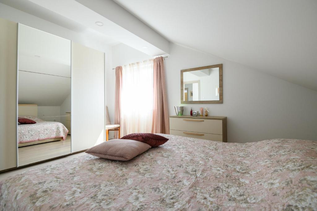 Postel nebo postele na pokoji v ubytování Apartments Rašica