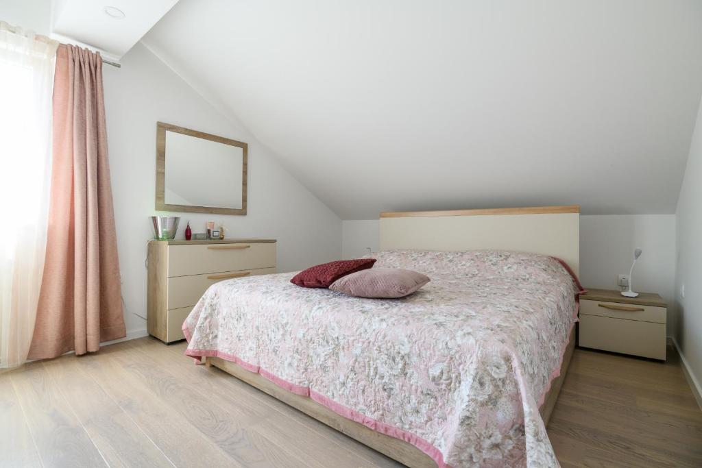 Postel nebo postele na pokoji v ubytování Apartments Rašica