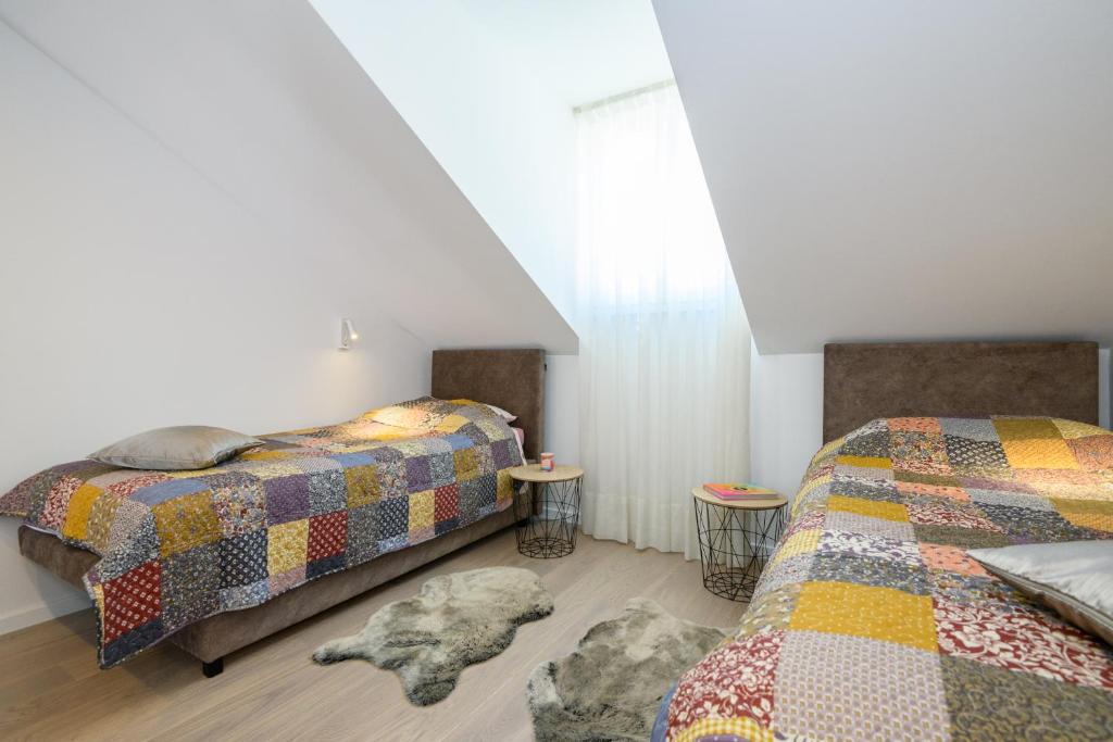 Postel nebo postele na pokoji v ubytování Apartments Rašica