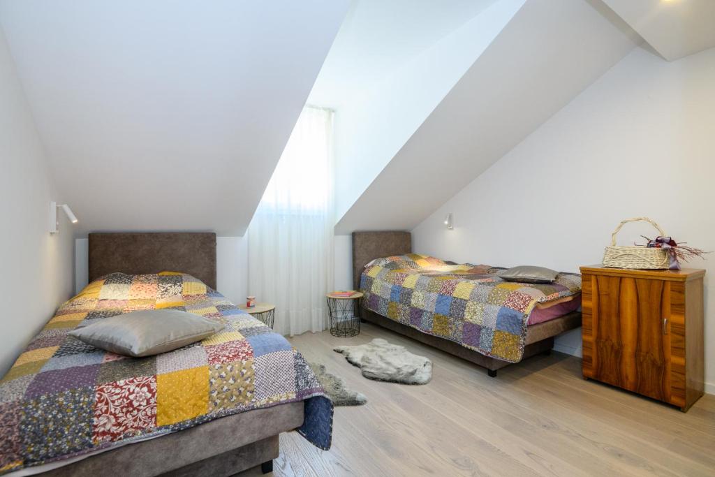 Postel nebo postele na pokoji v ubytování Apartments Rašica