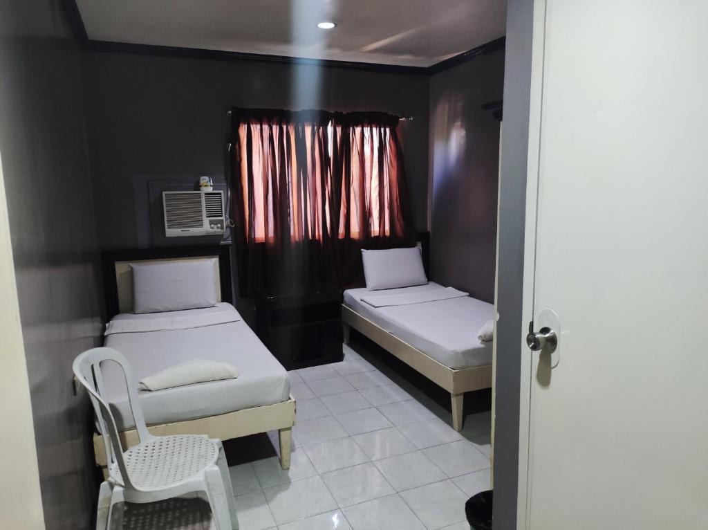 Postel nebo postele na pokoji v ubytování Parkview Hotel