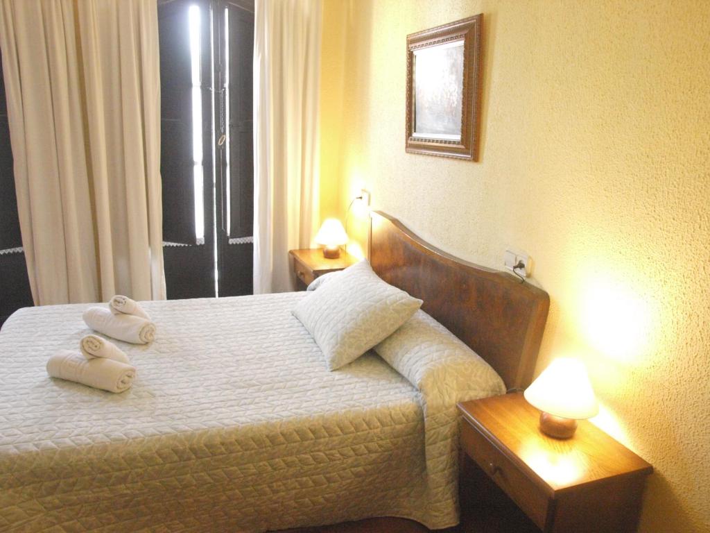 Postel nebo postele na pokoji v ubytování Pensión Plaza del Ayuntamiento