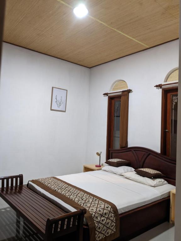 Postel nebo postele na pokoji v ubytování Ubud Dream