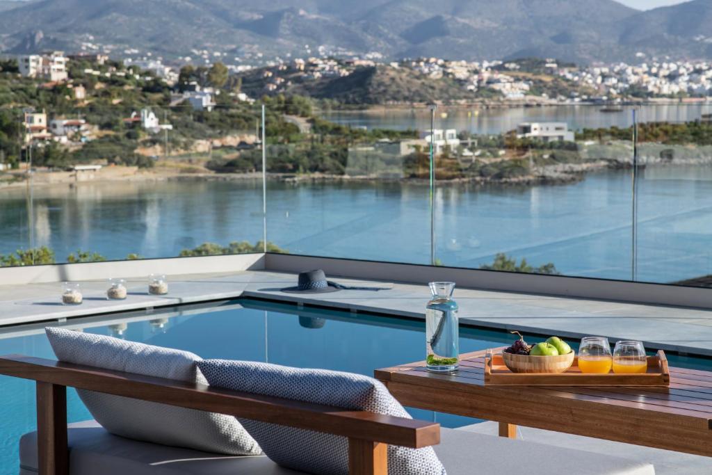 a view of a swimming pool from a house at Blue Senses Villas in Agios Nikolaos