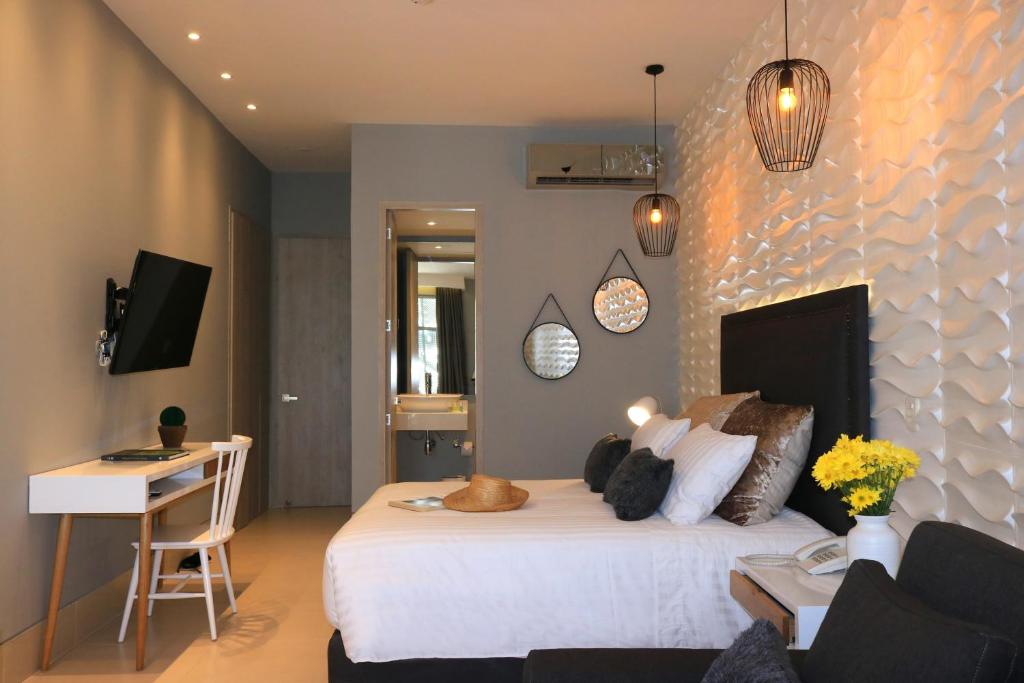 TV a/nebo společenská místnost v ubytování Bonita Bay Concept Hotel by Xarm Hotels