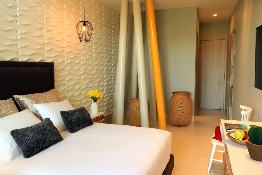 Postel nebo postele na pokoji v ubytování Bonita Bay Concept Hotel by Xarm Hotels