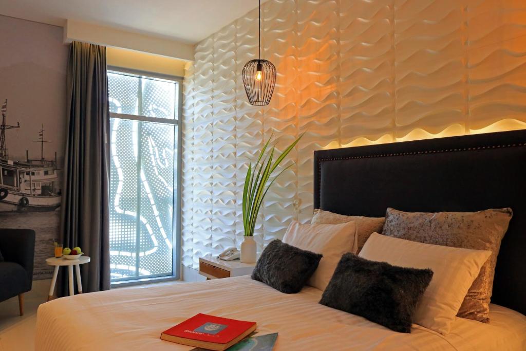 Postel nebo postele na pokoji v ubytování Bonita Bay Concept Hotel by Xarm Hotels