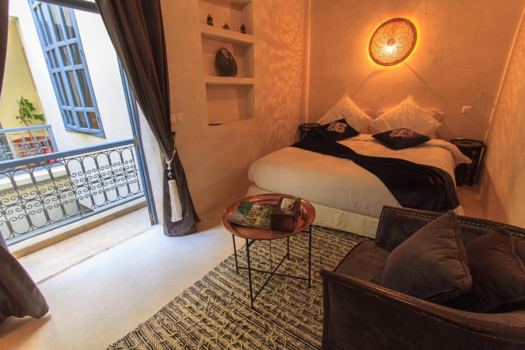 Postel nebo postele na pokoji v ubytování Riad La Porte de l'oasis