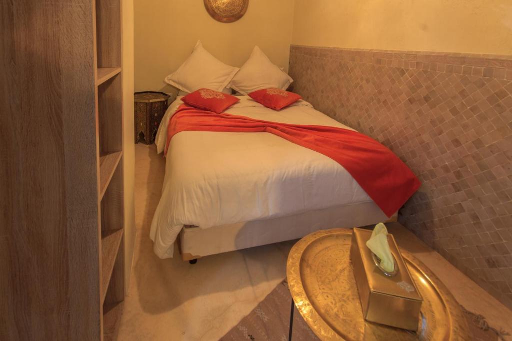 Postel nebo postele na pokoji v ubytování Riad La Porte de l'oasis