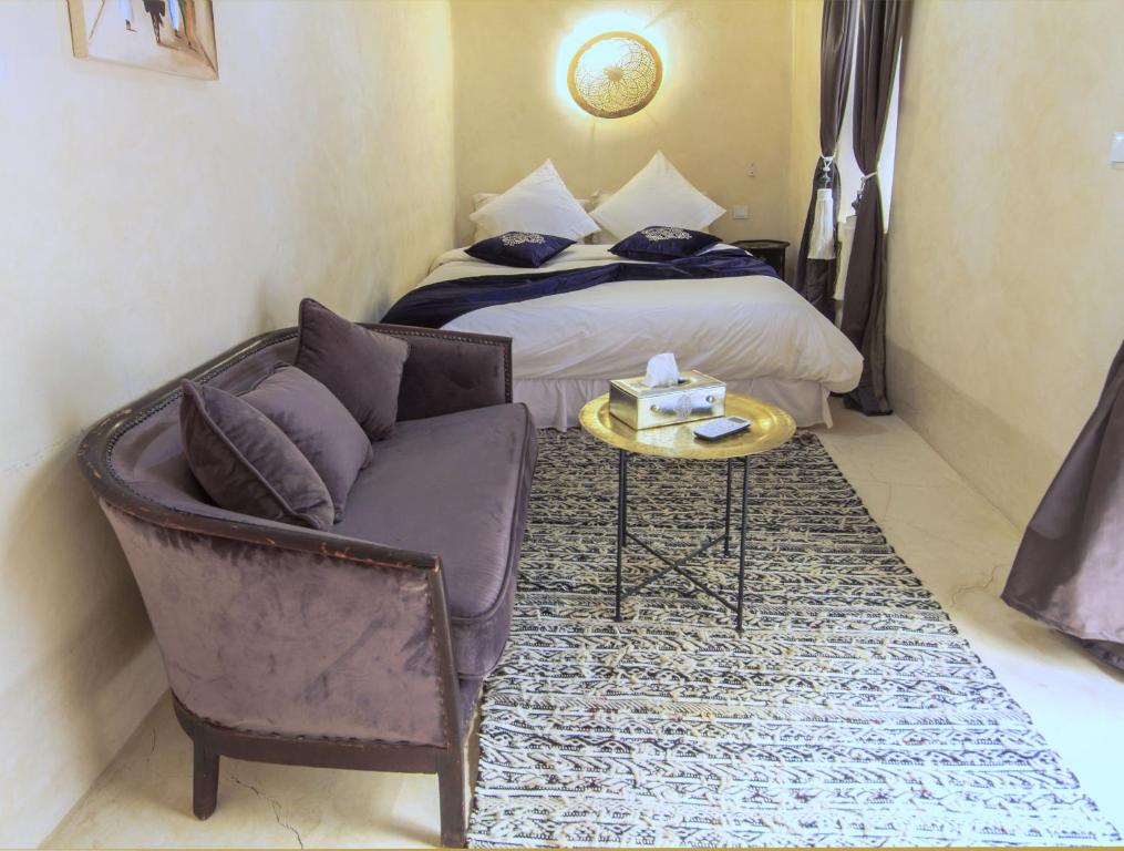 Postel nebo postele na pokoji v ubytování Riad La Porte de l'oasis