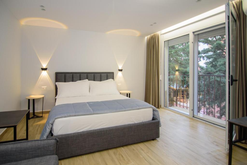 Letto o letti in una camera di Palm Side Hotel