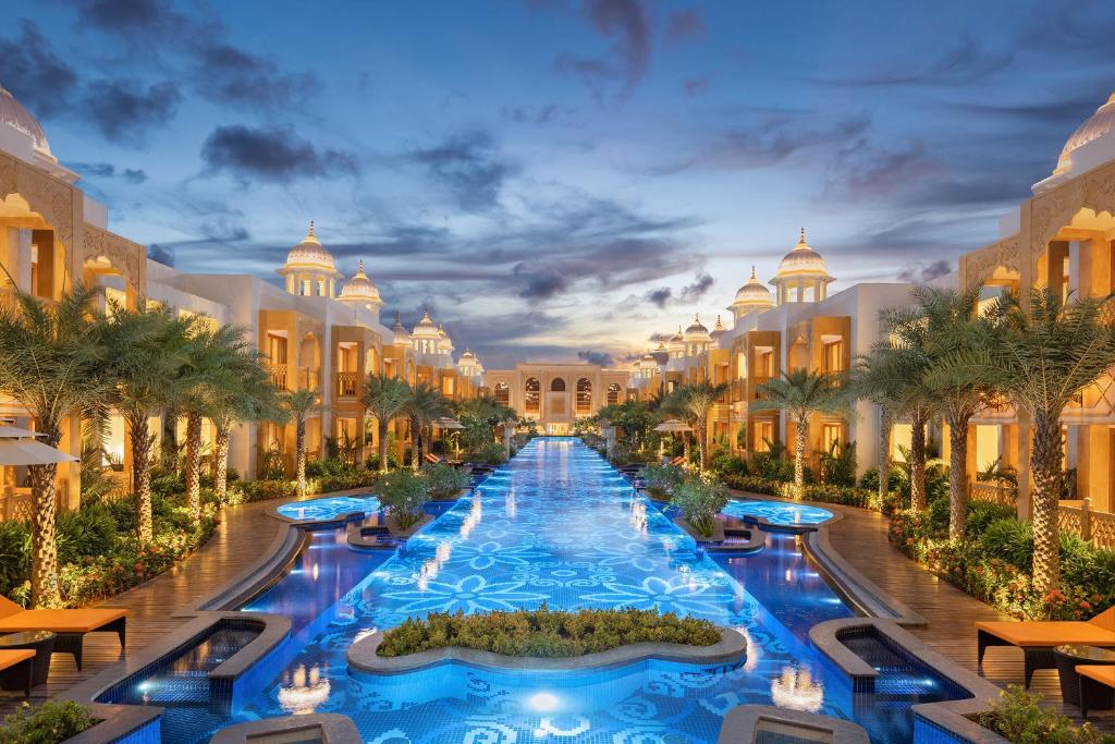 a rendering of the exterior of a resort with a swimming pool at Kaldan Samudhra Palace in Mahabalipuram