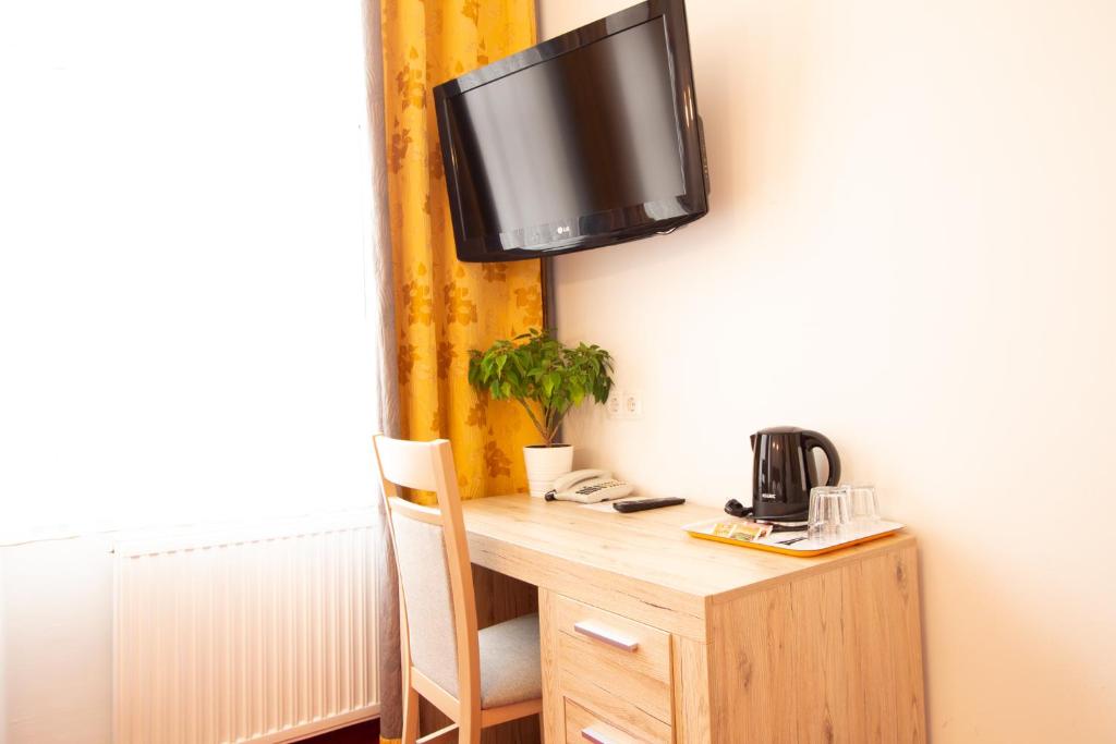 TV a/nebo společenská místnost v ubytování Hotel Klimt