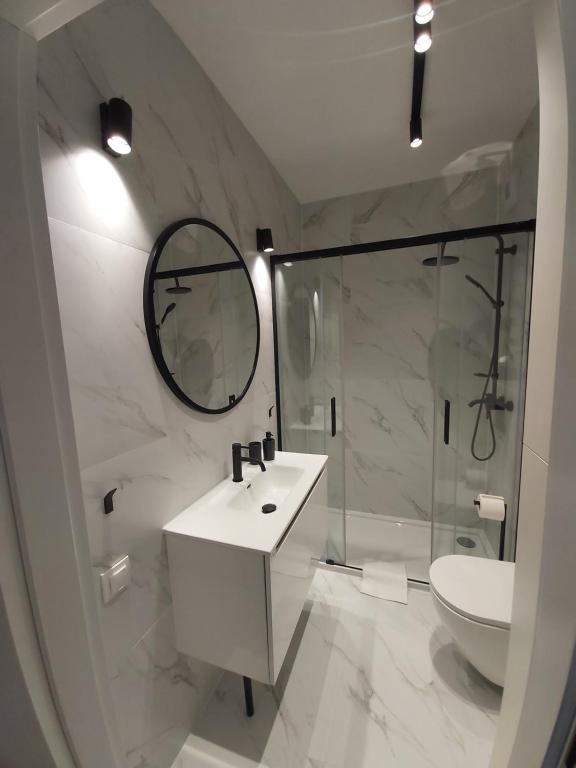 Kúpeľňa v ubytovaní Apartament 150 Zaspa VVita