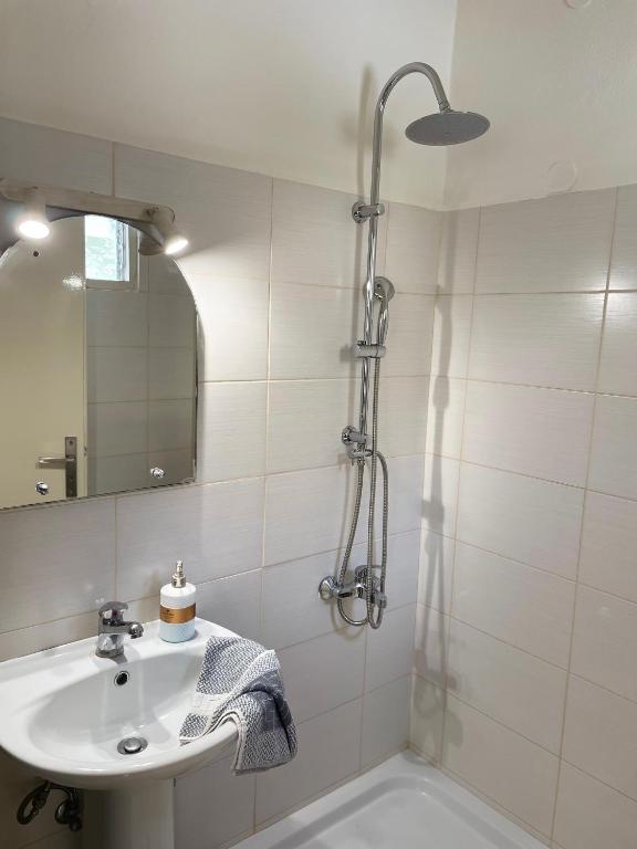 a bathroom with a sink and a shower at Villa Sylvia in Matala