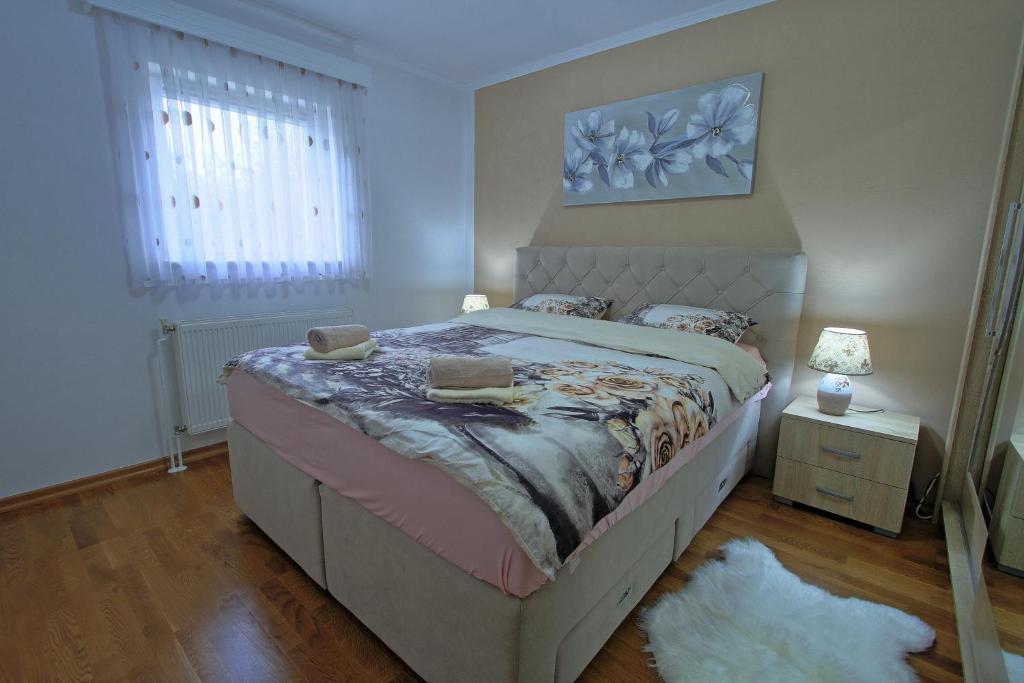 Postel nebo postele na pokoji v ubytování Holiday House Lana