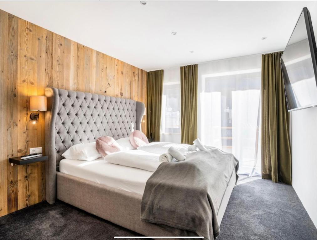 Ein Bett oder Betten in einem Zimmer der Unterkunft LovetheAlps Apartments