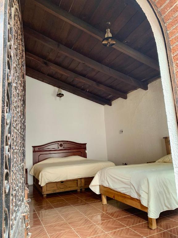 Postel nebo postele na pokoji v ubytování Hotel La Condesa