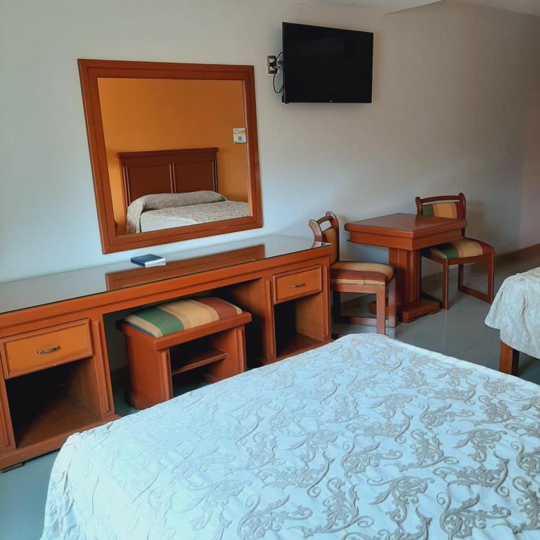 Postel nebo postele na pokoji v ubytování Hotel Gran Via - Centro
