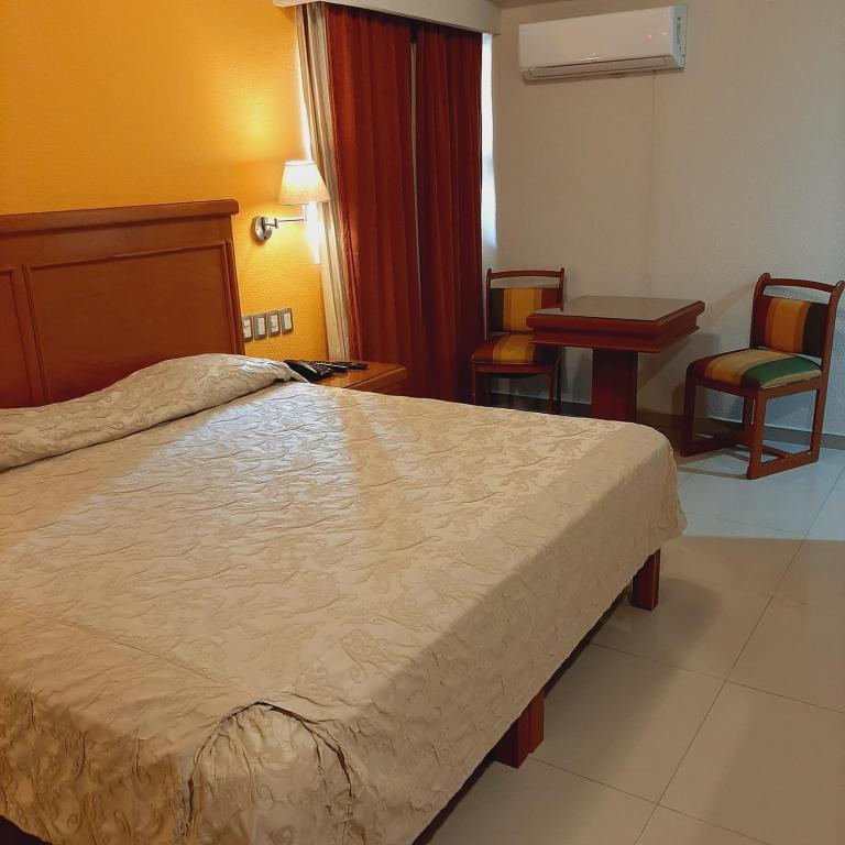 Postel nebo postele na pokoji v ubytování Hotel Gran Via - Centro