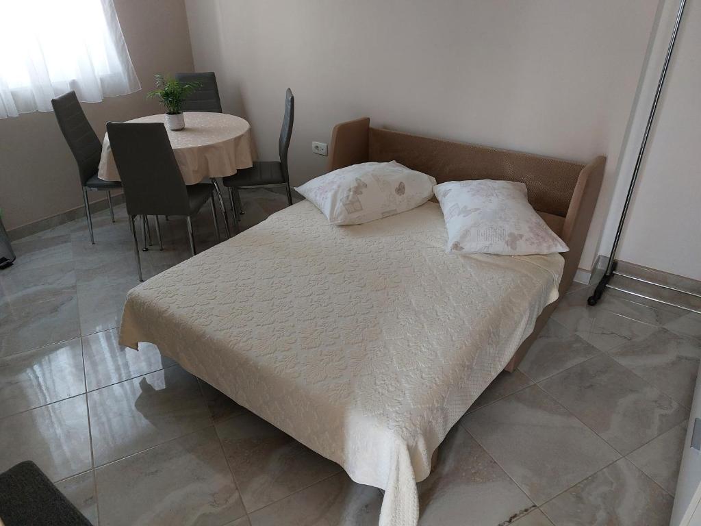 Posteľ alebo postele v izbe v ubytovaní Modrika Apartments