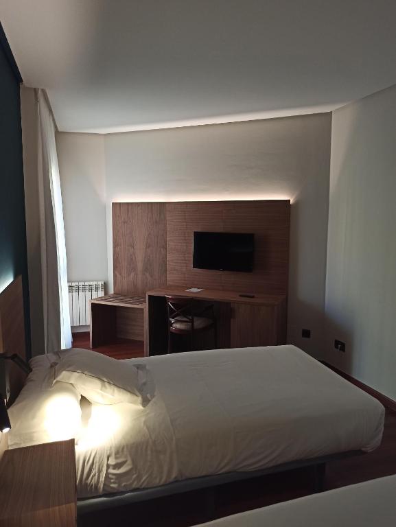 Postel nebo postele na pokoji v ubytování ARVA Spa París
