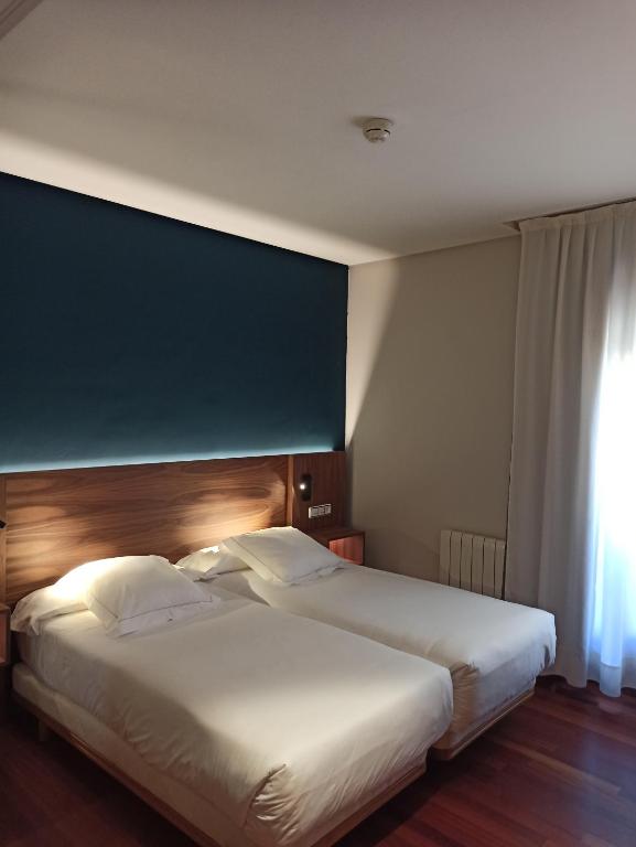 Postel nebo postele na pokoji v ubytování ARVA Spa París