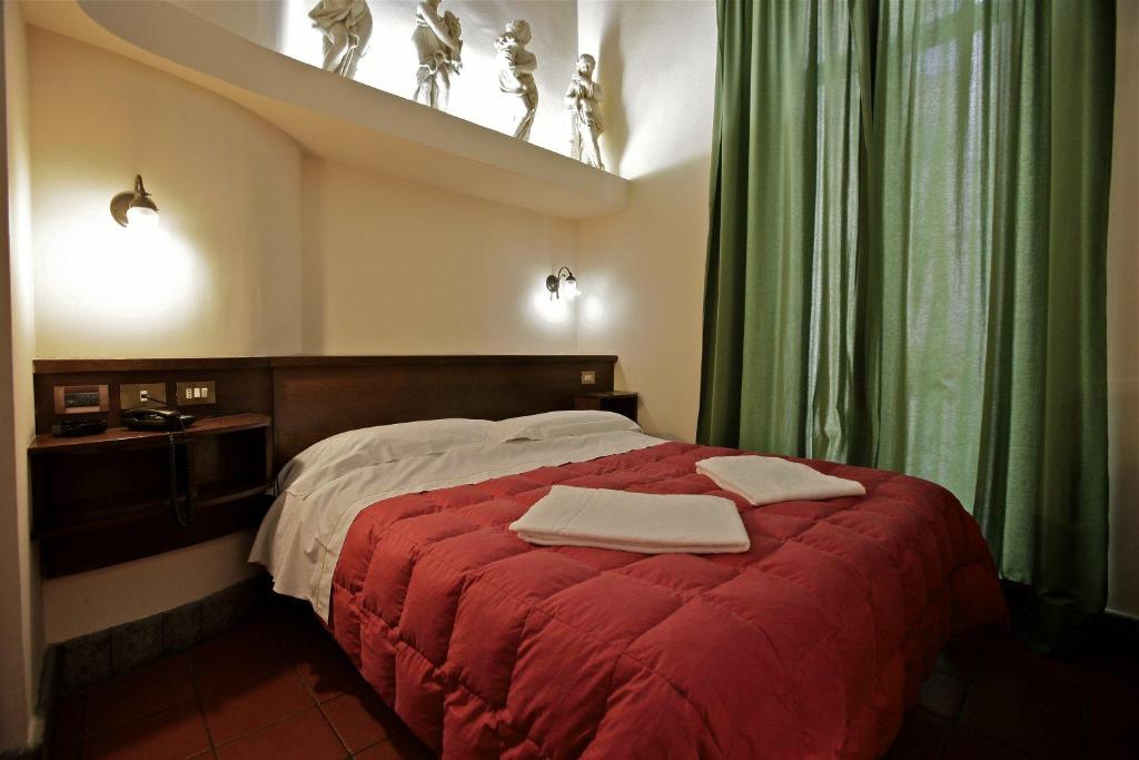 Postel nebo postele na pokoji v ubytování Hotel Panda
