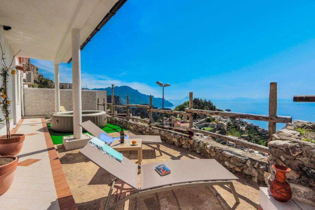 an outdoor patio with a view of the ocean at Villa Salice in Amalfi