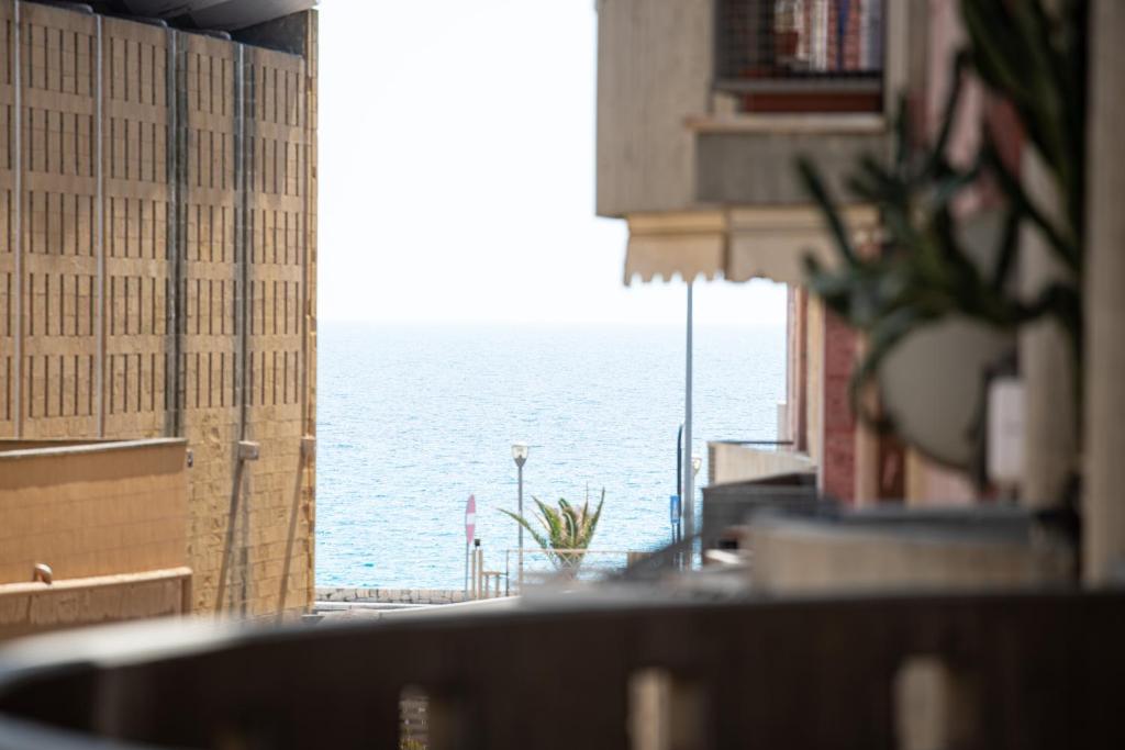 a view of the ocean from a building at Sunset home Baia Blu in Gallipoli