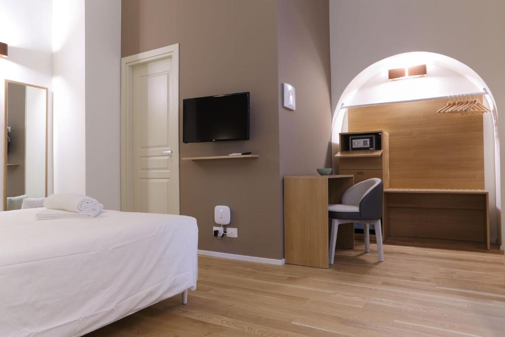 Televízia a/alebo spoločenská miestnosť v ubytovaní B&B Castanea