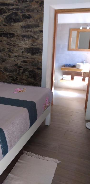 Postel nebo postele na pokoji v ubytování Casa do Avô
