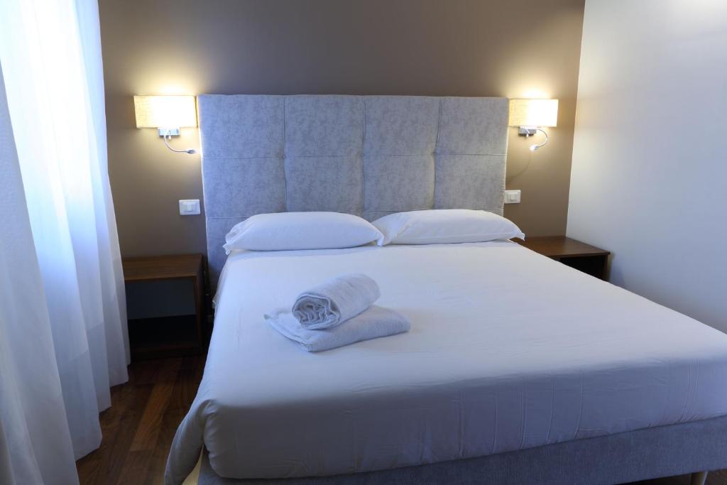 Posteľ alebo postele v izbe v ubytovaní B&B Castanea