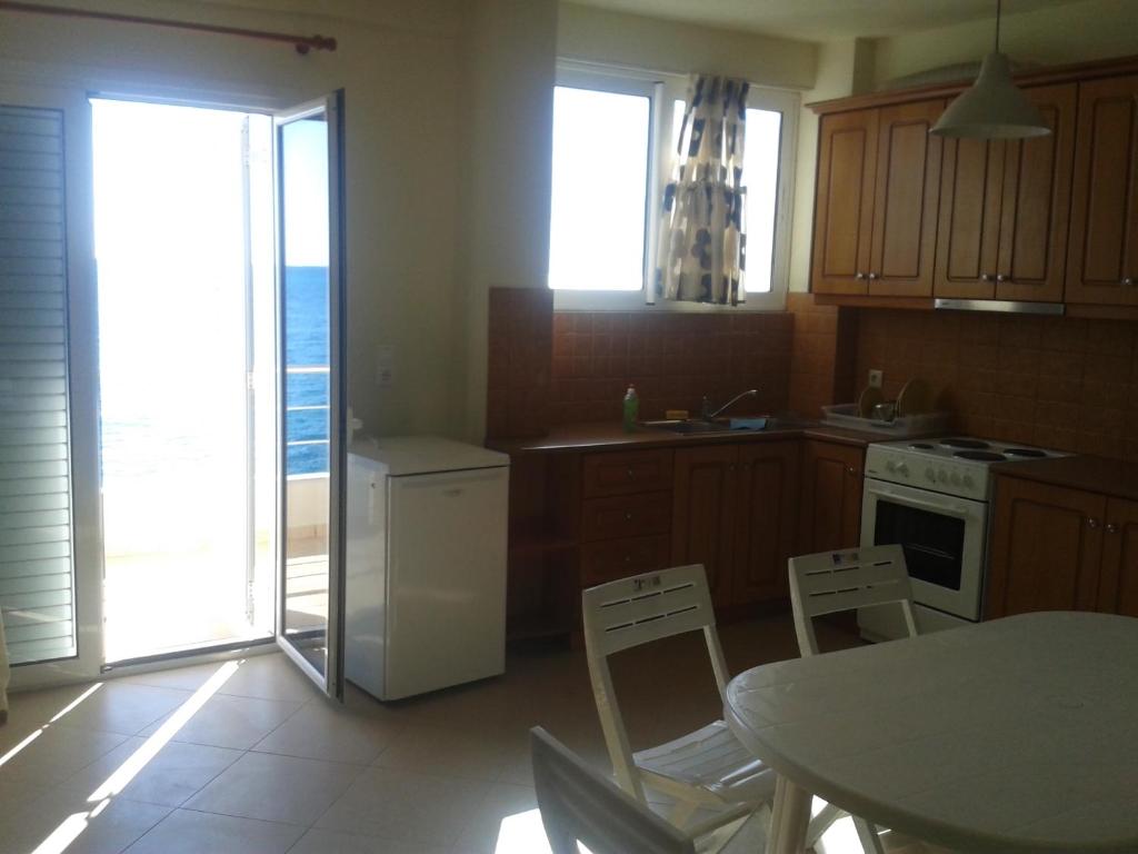 Kuchyň nebo kuchyňský kout v ubytování Magic Ionian Apartments & Rooms