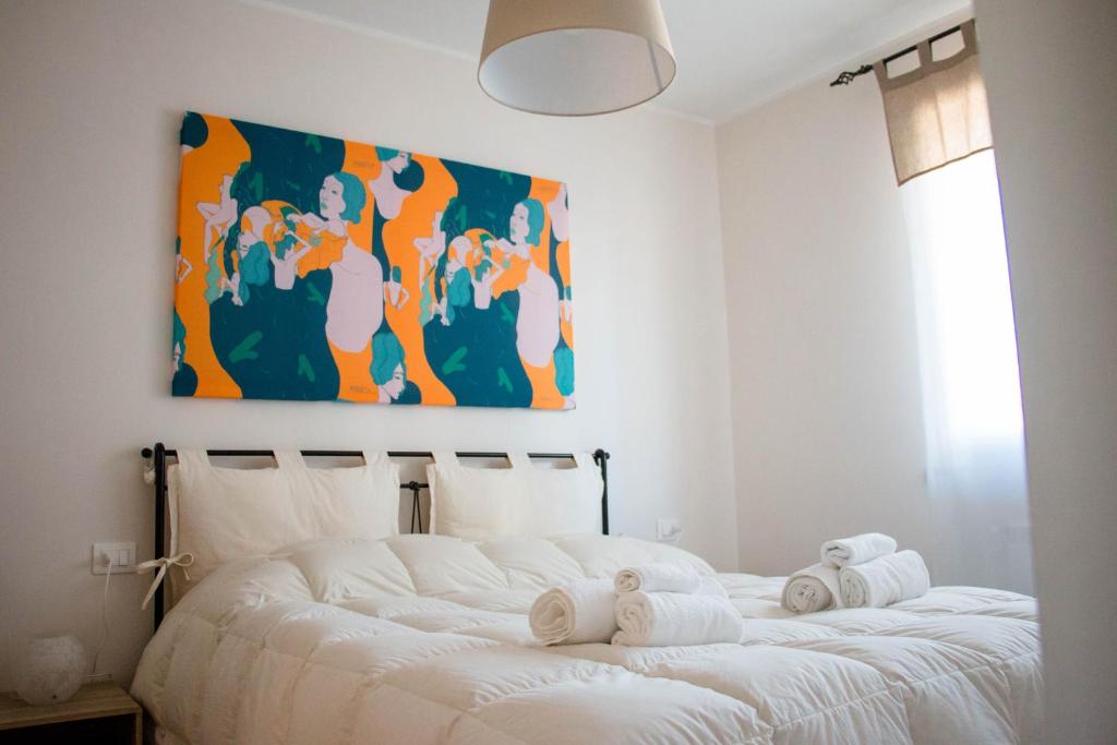 Кровать или кровати в номере Vento e Amore