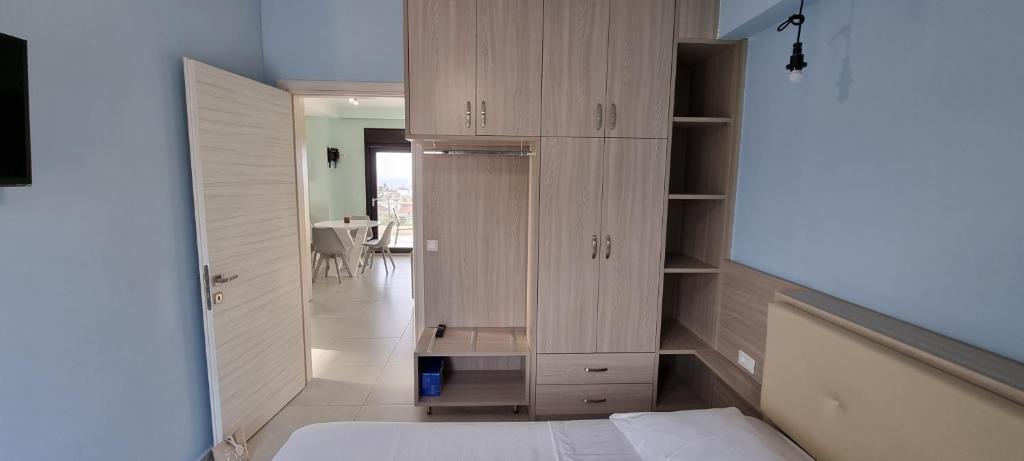 Łóżko lub łóżka w pokoju w obiekcie Sandy Cozy Apartments