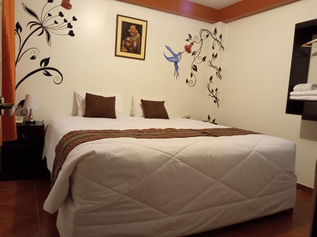 Ein Bett oder Betten in einem Zimmer der Unterkunft Inkas Land