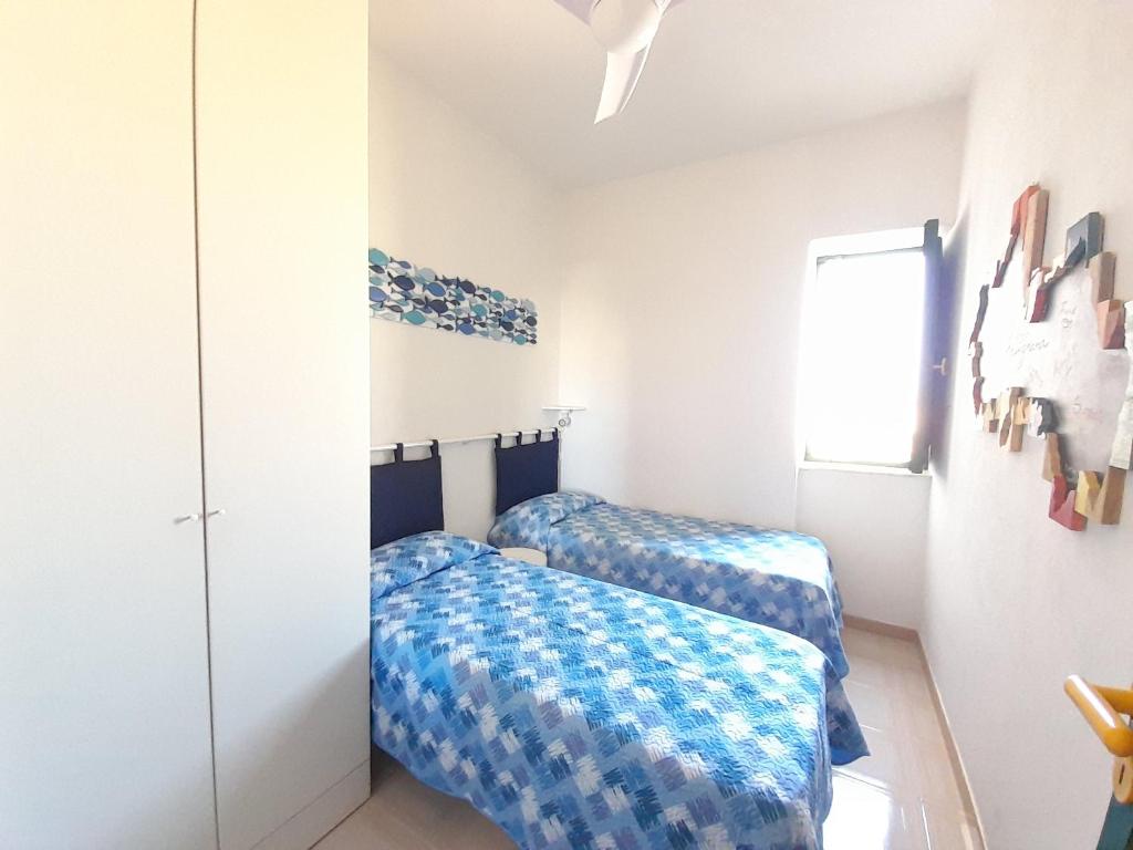 Posteľ alebo postele v izbe v ubytovaní Casa Flavin Favignana