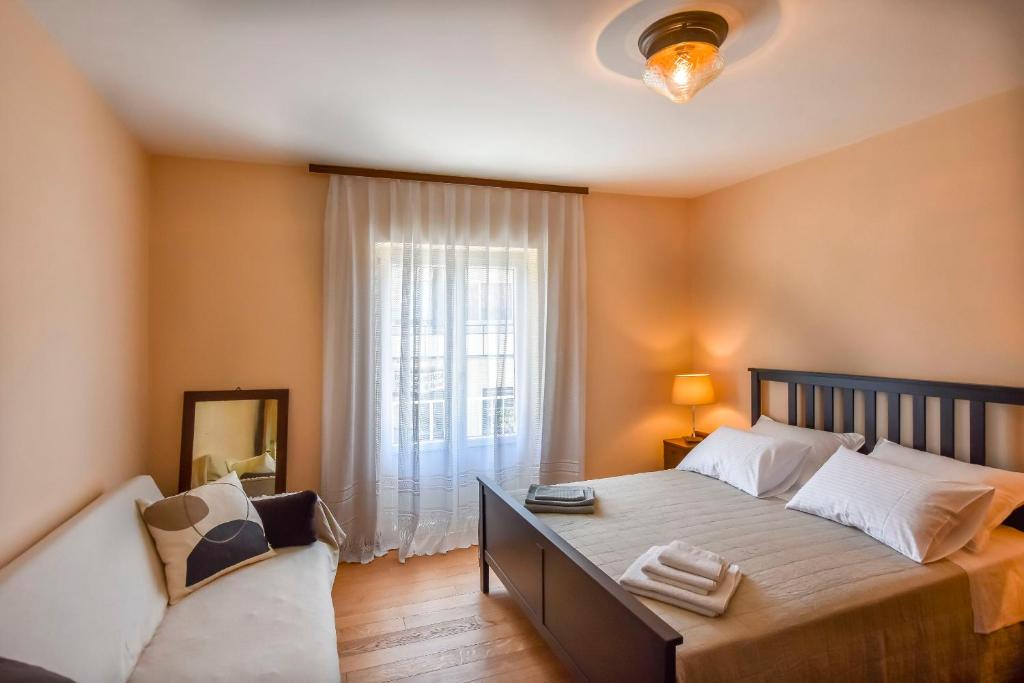 Postel nebo postele na pokoji v ubytování Apartment Filomena