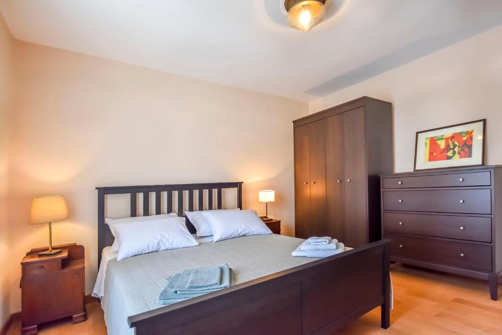 Postel nebo postele na pokoji v ubytování Apartment Filomena