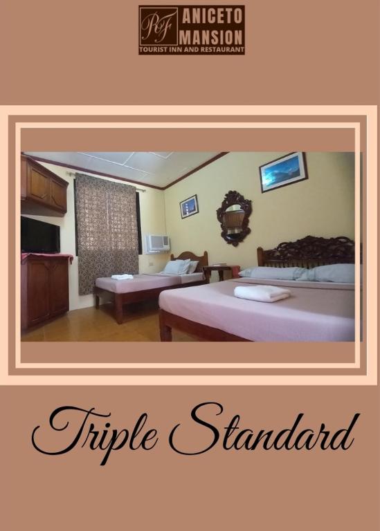a picture of a hotel room with two beds at RF Aniceto Mansion in Vigan