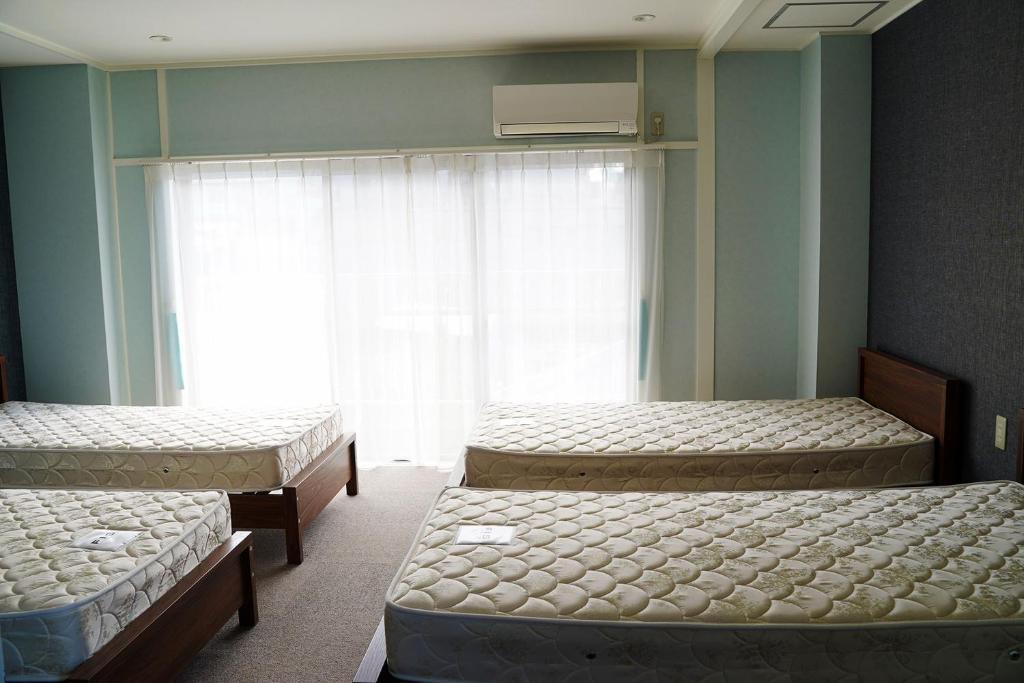 Cama o camas de una habitación en Usatsuno Osu