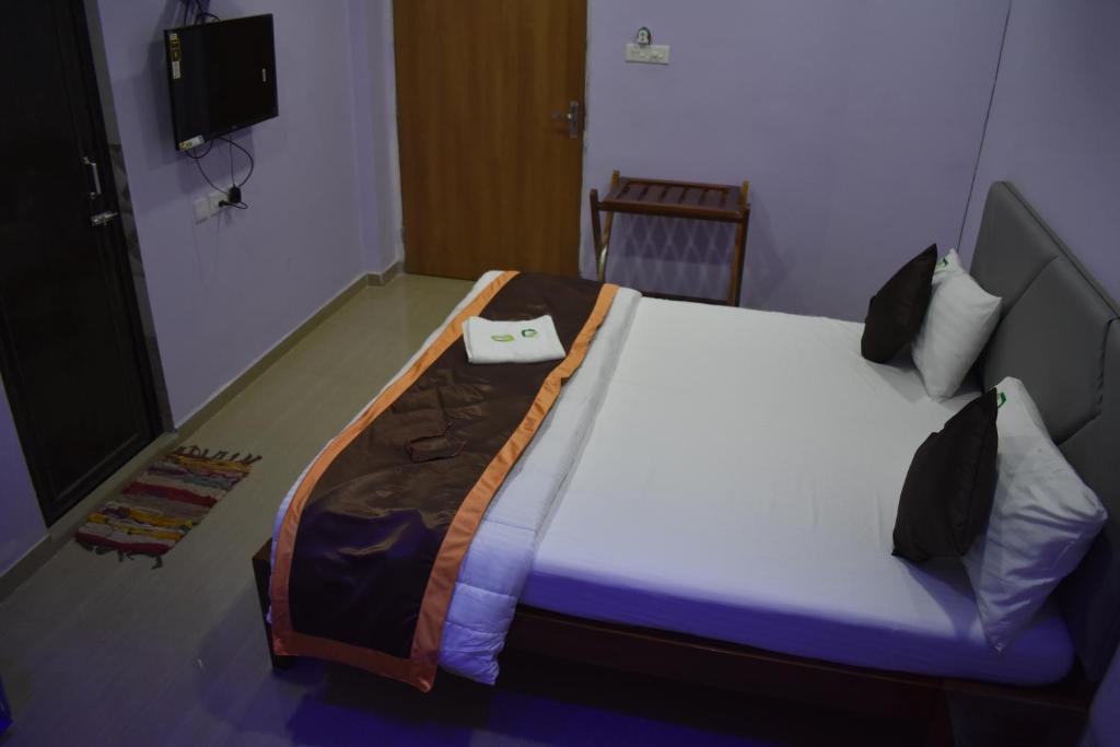 Postel nebo postele na pokoji v ubytování HOTEL PURI GREENS