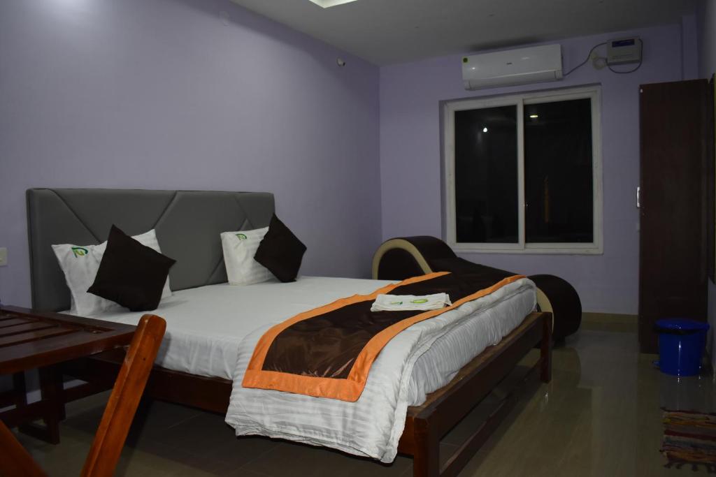 Postel nebo postele na pokoji v ubytování HOTEL PURI GREENS