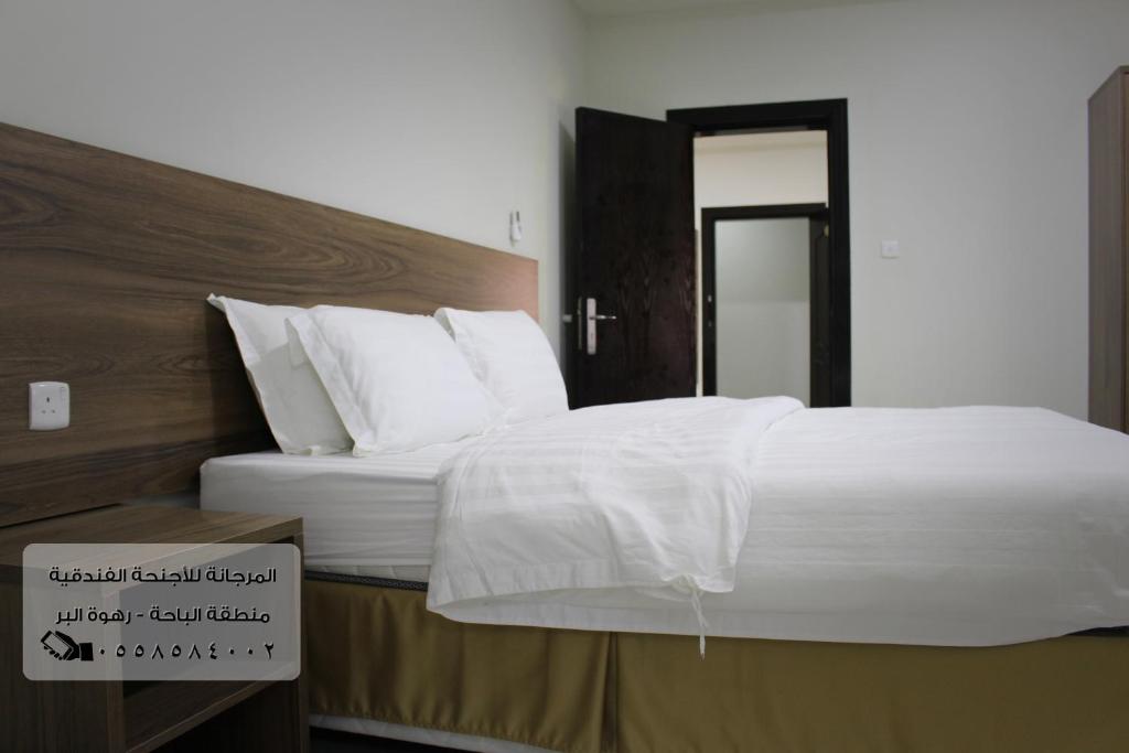 Postel nebo postele na pokoji v ubytování المرجانة للشقق المفروشه للعائلات Al Murjana Furnished Apartments for Families
